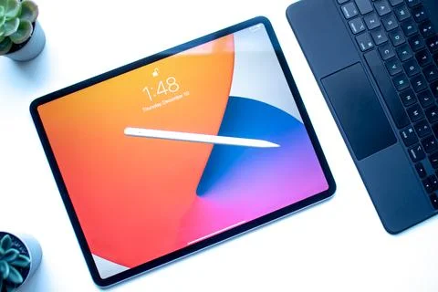 An iPad Pro 12.9 inch with and an Apple Pencil 2nd Generation and a Magic Keyboa Stock Photos