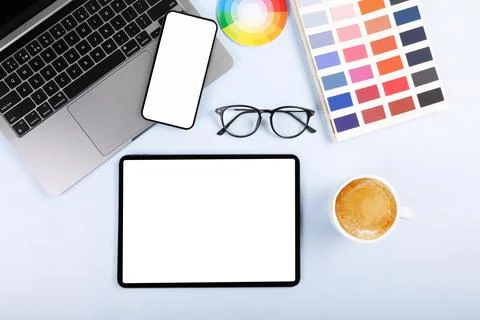 IPad pro with white screen on white color background. Flatlay. Office background Stock Photos