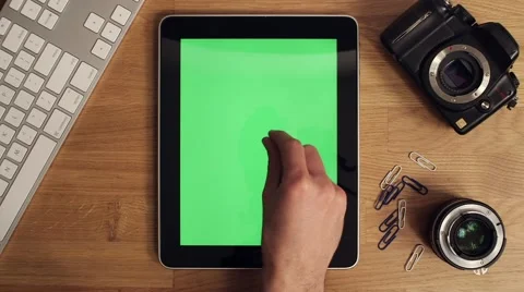 Ipad user at desk Видео 63391296