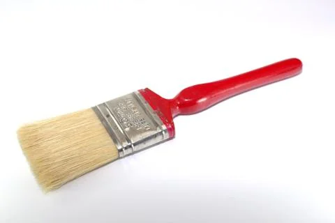 IPaint brush width 2 inches with a red handle on a white background Foto stock