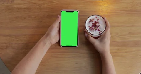 IPhone 11 with green screen place on wooden table. Pre keyed green screen Stock Footage 135814997