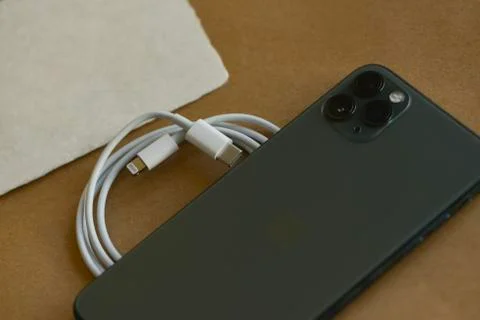 Iphone 11 Pro Max with fast charger Stock Photos