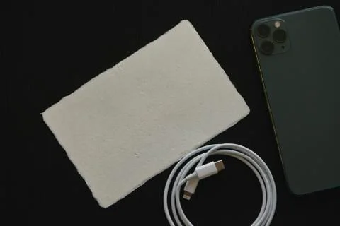 Iphone 11 Pro Max with fast charger Stock Photos