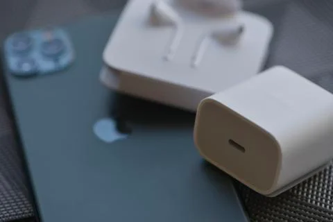 IPhone 11 Pro Max with original earphones and fast charger Stock Photos