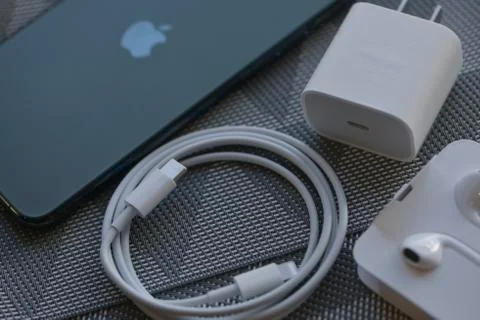 IPhone 11 Pro Max with original earphones and fast charger Stock Photos