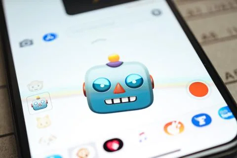 IPhone 11 Pro with Robot faces expressing sentiments Stock Photos
