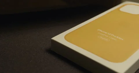 Iphone 12 Pro max, close up, Apple logo over California poppy leather case 스톡 동영상 144644827