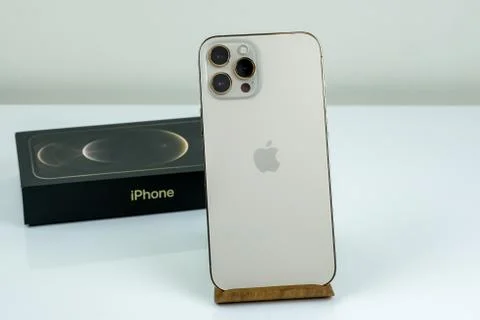 IPhone 12 Pro Max Gold next to its box Stock Photos