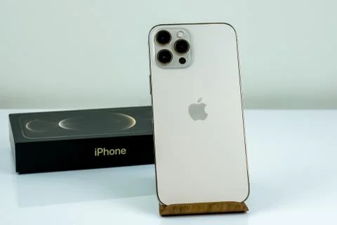IPhone 12 Pro Max Gold next to its box Stock Photos