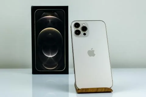 IPhone 12 Pro Max Gold next to its box Stock Photos