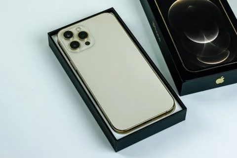 IPhone 12 Pro Max Gold next to its box Stock Photos