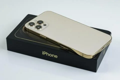 IPhone 12 Pro Max Gold next to its box Stock Photos
