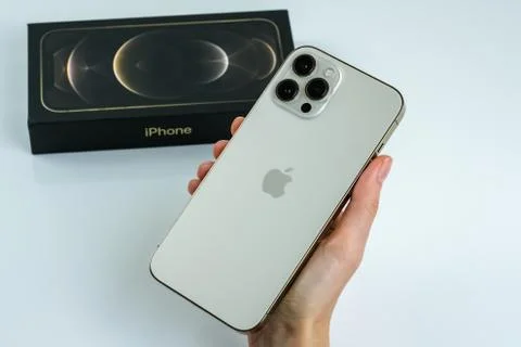 IPhone 12 Pro Max Gold next to its box Stock Photos