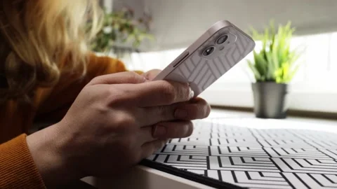 Iphone 12,Woman texting on smartphone, chatting on mobile device, scrolling.. Stock Footage 252381453