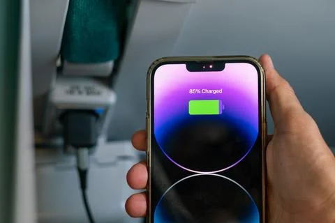 IPhone 13 Pro max charging during a train ride Stock Photos