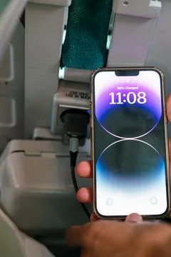 IPhone 13 Pro max charging during a train ride Stock Photos