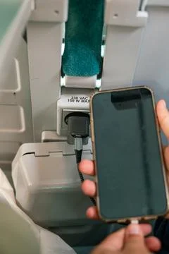 IPhone 13 Pro max charging during a train ride Stock Photos