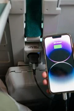 IPhone 13 Pro max charging during a train ride Stock Photos