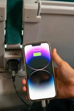 IPhone 13 Pro max charging during a train ride Stock Photos