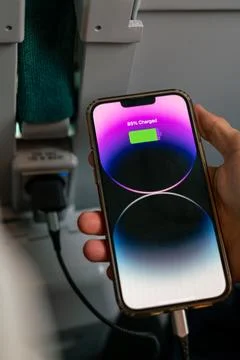 IPhone 13 Pro max charging during a train ride Stock Photos