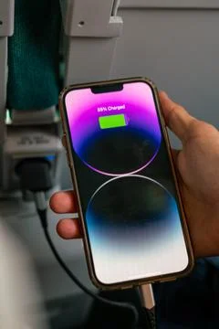 IPhone 13 Pro max charging during a train ride Stock Photos
