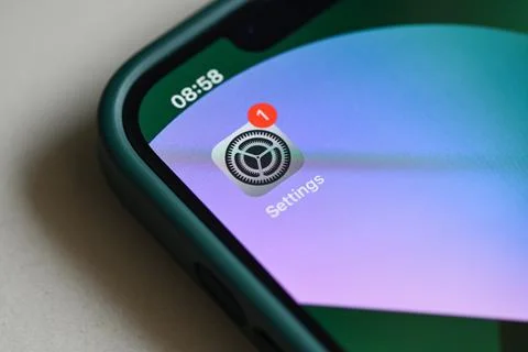 IPhone 13 Pro with notification software update on settings app iOS 15.5 on t Stock Photos