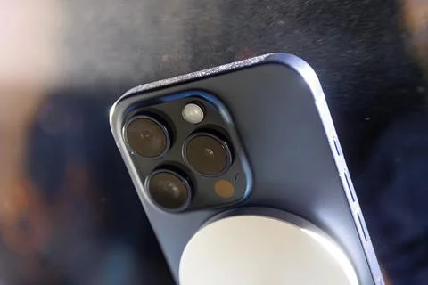 Iphone 15 from the back. Tripe and double Iphone 15 Pro Titanium camera Stock Photos