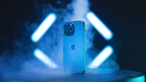 IPhone 15 Pro Max on turntable blasted with smoke from above 4K Video stock 258265941