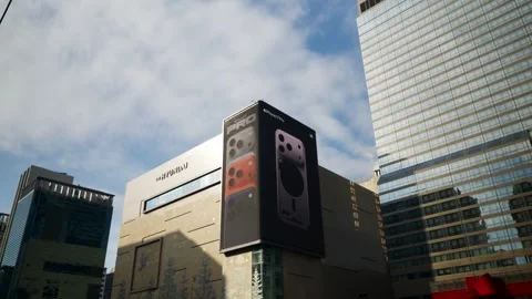 IPhone 17 Pro Advertisement on Digital Billboard Mounted on Walls of Hyundai Stock Footage 323184046