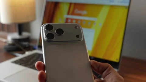 IPhone 17 Pro Max in silver colour Hands on video Stock Footage 328829408