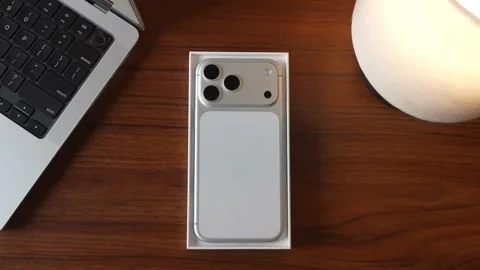 IPhone 17 Pro Max in silver colour Unboxing video Stock Footage 328830369