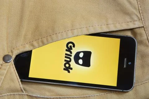 IPhone 5s with mobile application for Grindr on the screen Stock Photos