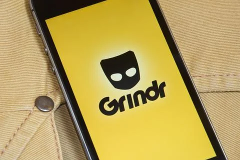 IPhone 5s with mobile application for Grindr on the screen Stock-Fotos