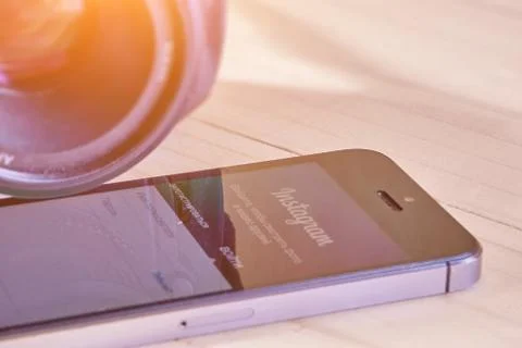 IPhone 5s with mobile application for Instagram Stock Photos