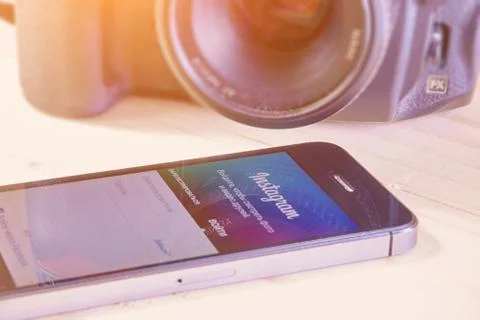 IPhone 5s with mobile application for Instagram Stock Photos