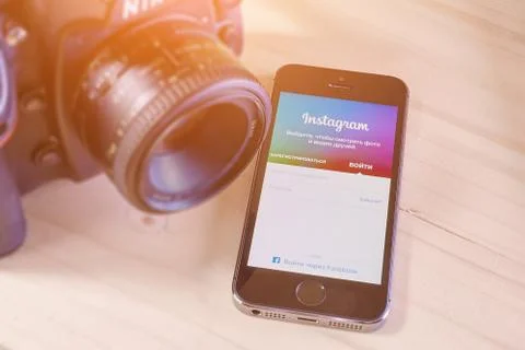 IPhone 5s with mobile application for Instagram Stock Photos