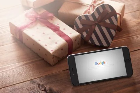 Iphone 6 plus among gift-boxes Fotos de archivo