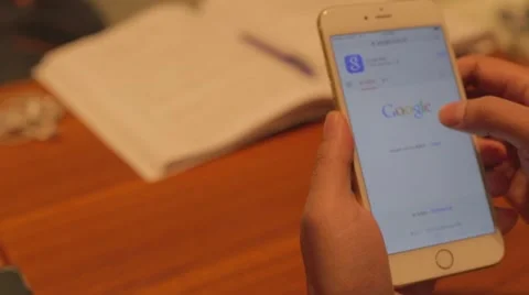 Iphone 6 plus - cinematic businessman scrolls uses google search Stock Footage 45979396
