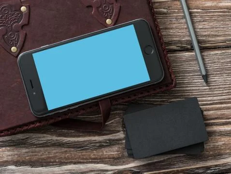 Iphone 6 plus next to black b-cards 写真素材