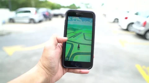 Iphone 6S Plus user playing Pokemon Go for the first time. Stock Footage 65773200
