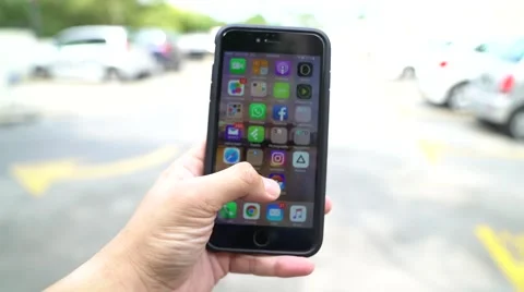 Iphone 6S Plus user playing Pokemon Go for the first time. Stock Footage 65773211