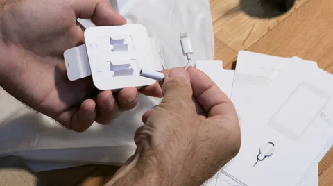 IPhone 7 plus dual camera unboxing Lightning to 3.5 mm Headphone Jack Adapter Stock Footage 67932670