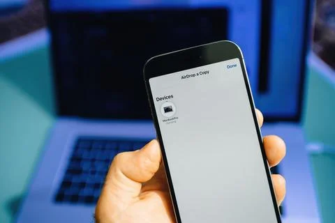 IPhone AirDrop Transfer with MacBook Pro Stock Photos