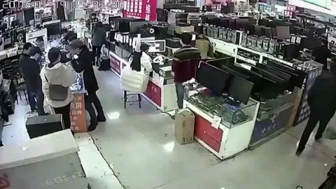 IPhone battery explodes in shop after customer BITES into it 動画素材 106296390