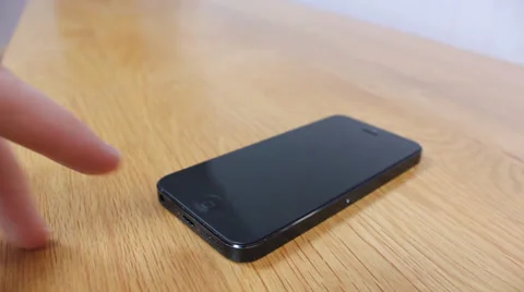 IPhone being terned on Video stock 36769003