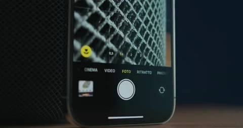 IPhone camera app on macro mode shooting Apple HomePod's fabric layer Stock Footage 235910088
