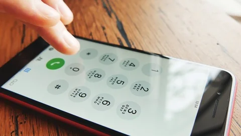 IPhone close up. Finger dials the phone number. Stock Footage 103613722