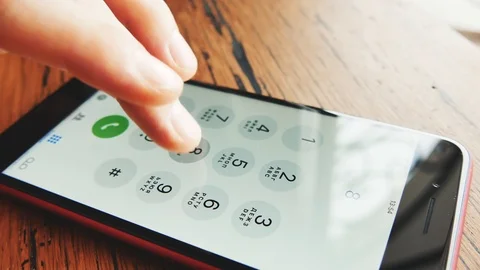 IPhone close up. Finger dials the phone number. Stock Footage 103613788