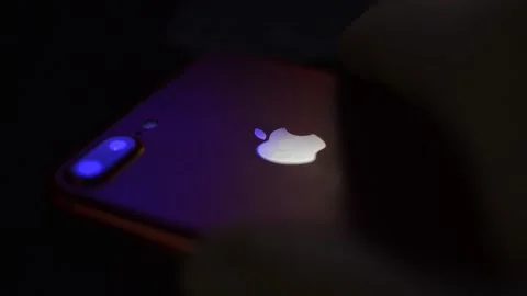 Iphone device by apple on a dark blur background. Vidéo 237507297