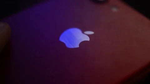 Iphone device by apple on the desk in a dark background. 스톡 동영상 236982039